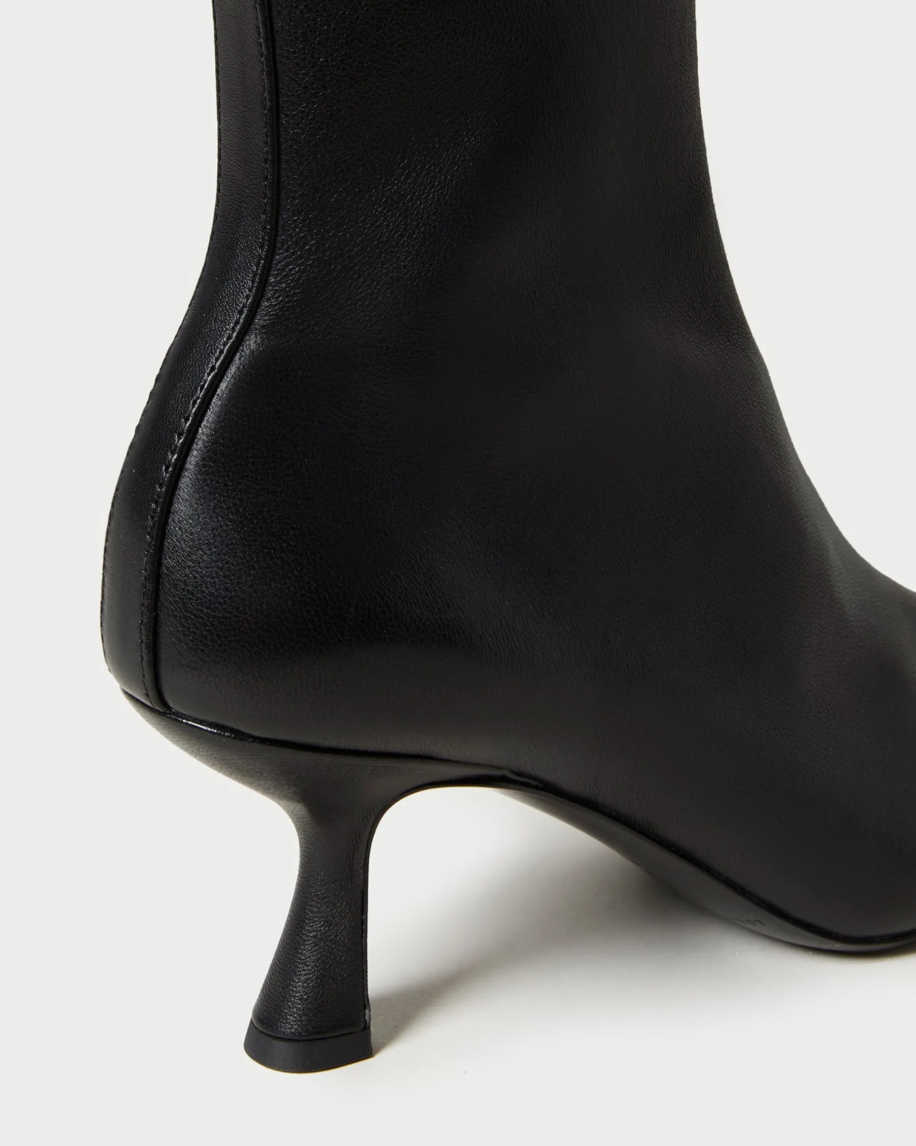 Thandy Black Curved Heel Bootie