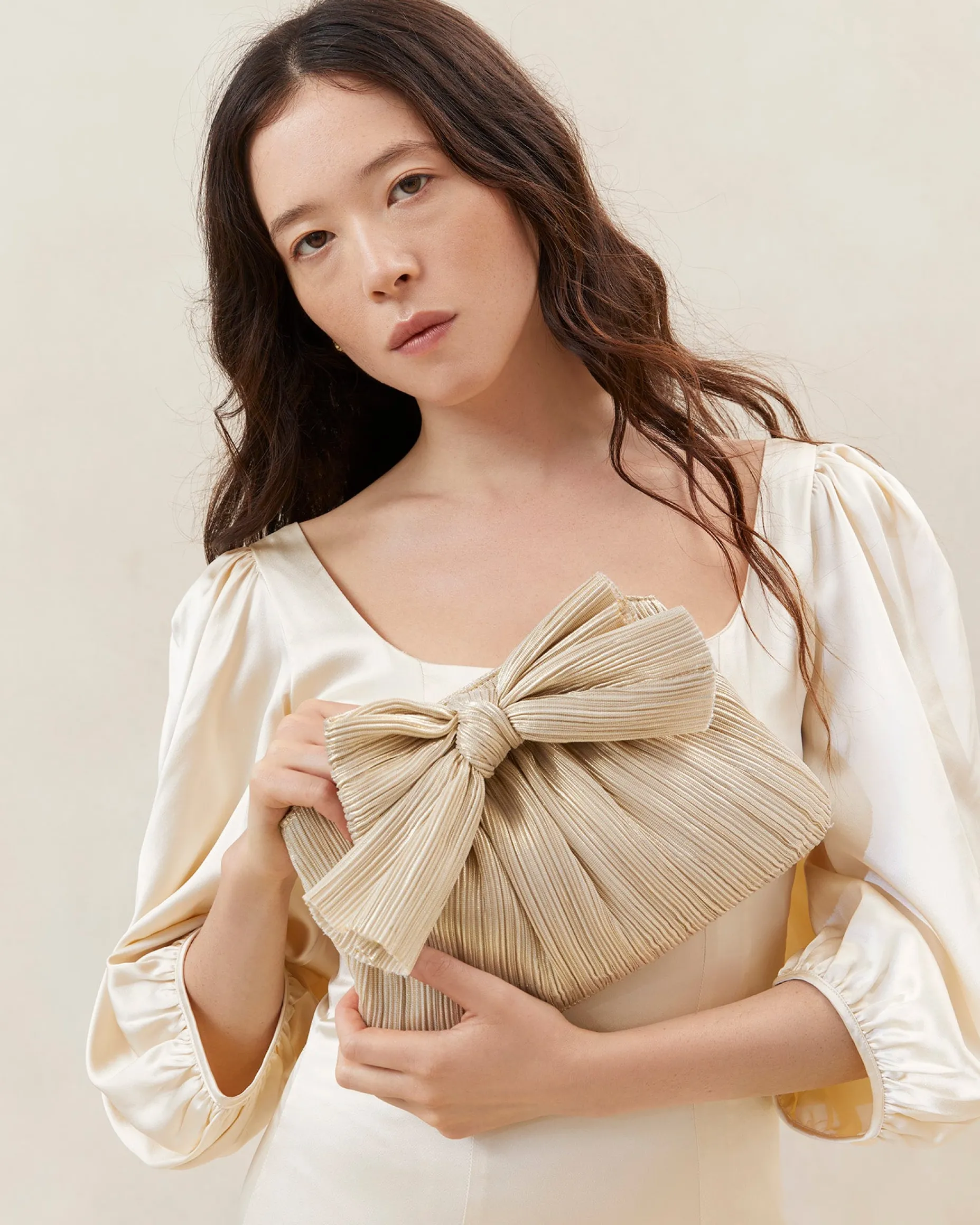 Rayne Champagne Bow Clutch
